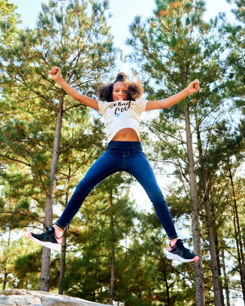 Girl Jumping at Park in The Woodlands